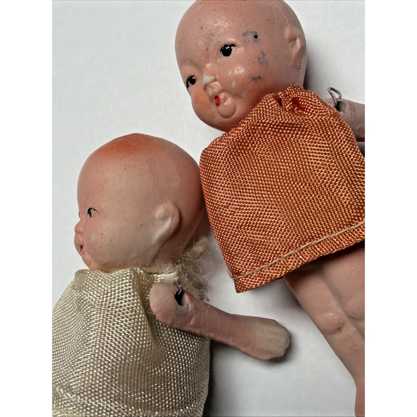 Old Lot of 4 Bisque Porcelain Baby Dolls Miniature Jointed Arms Dresses As Is