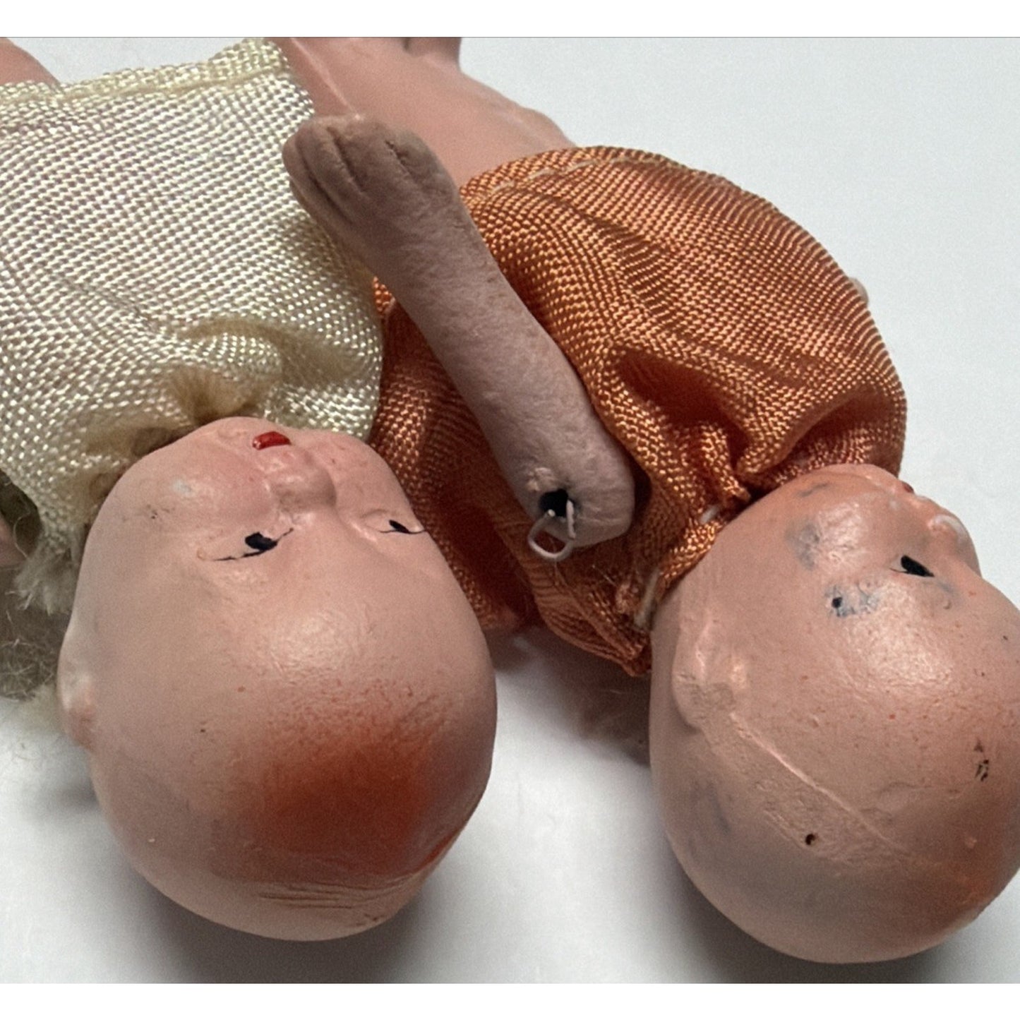 Old Lot of 4 Bisque Porcelain Baby Dolls Miniature Jointed Arms Dresses As Is